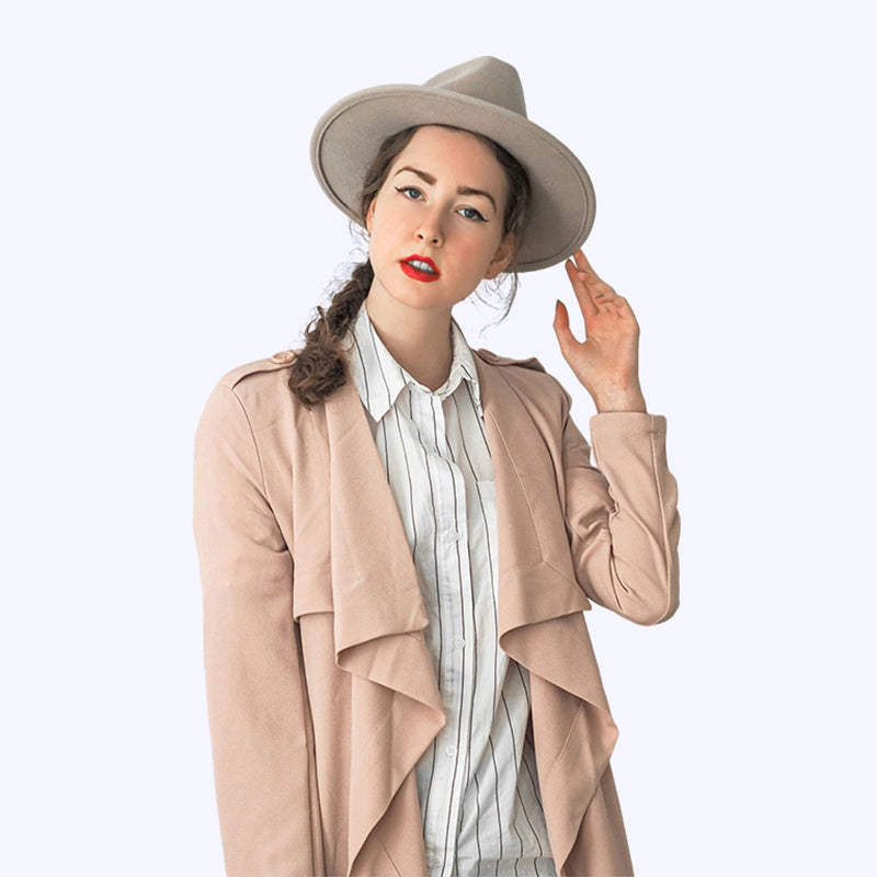 Long pink trench coat draped in soft leather