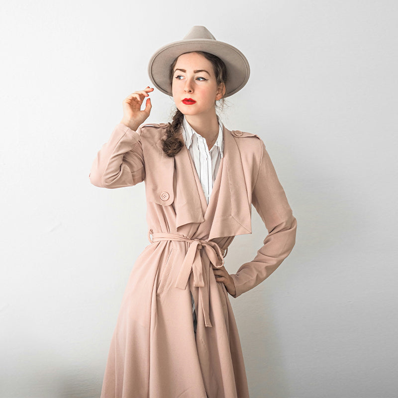 Long pink trench coat draped in soft leather