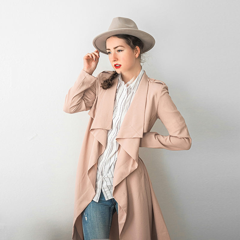 Long pink trench coat draped in soft leather