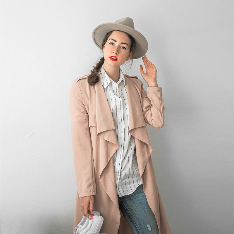 Long pink trench coat draped in soft leather